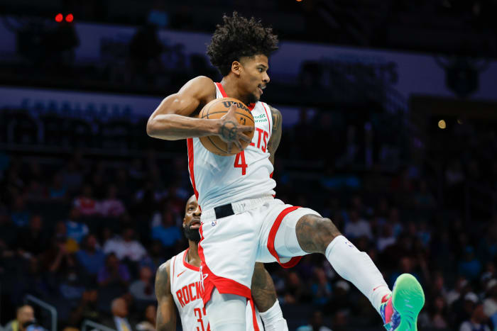 Rockets guard Jalen Green (4) pulls down a rebound against the Charlotte Hornets during the first quarter at Spectrum Center.